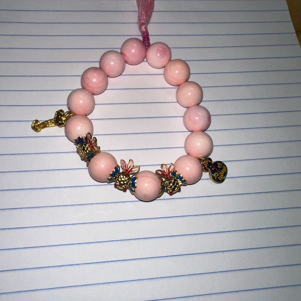 Pink Queen Conch Shell 12 mm beaded bracelet. To help extra love energy.